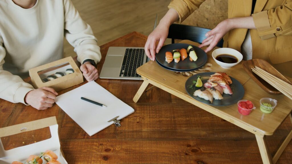 Women Eating Sushi at a Lunch Break